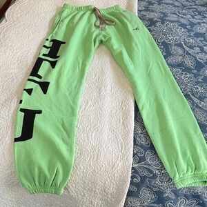 NWOT unisex soft green sweatpants with black lettering